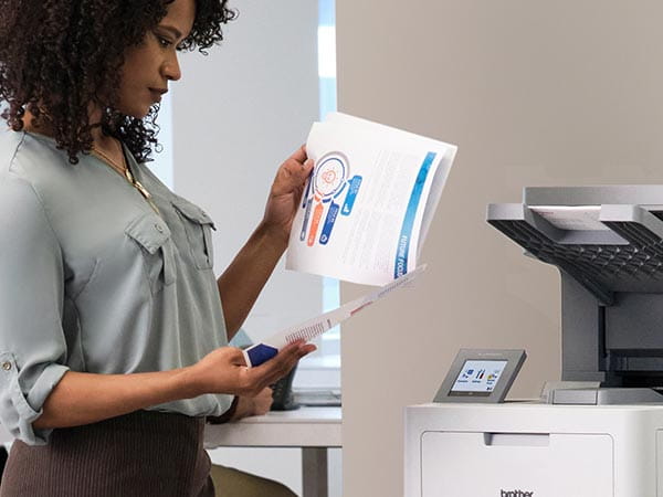 Woman reviewing multipage stapled business report