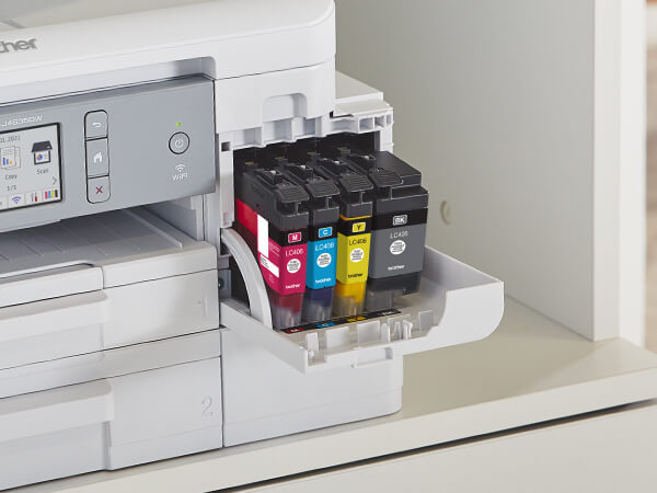 Man opening a Brother Genuine LC404 ink cartridge for printer