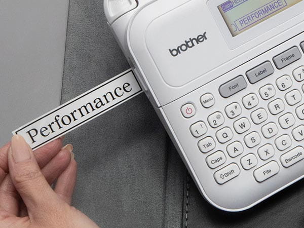 Woman in office  printing label from PTD410 label maker