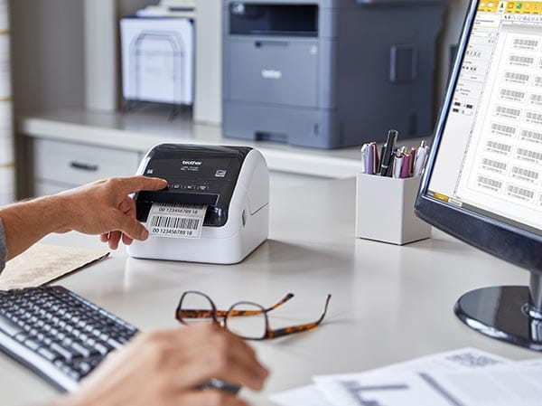 Person using software on PC to print barcode labels