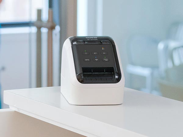 Label printer on reception desk in medical office