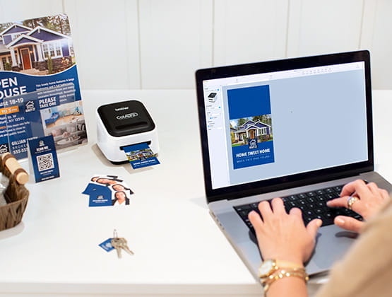 Person creating label on computer and printing to ColAura printer.