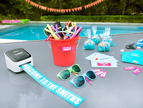 ColAura printing a large label in front of a pool. 