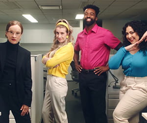 The Cartridge Family posing in an office. 