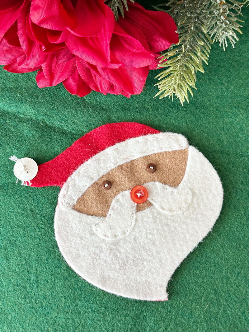 Felt Santa on green tabletop
