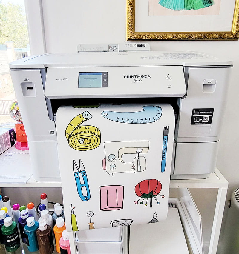 Brother Printmoda Studio Fabric Printer printing clip art into sheet