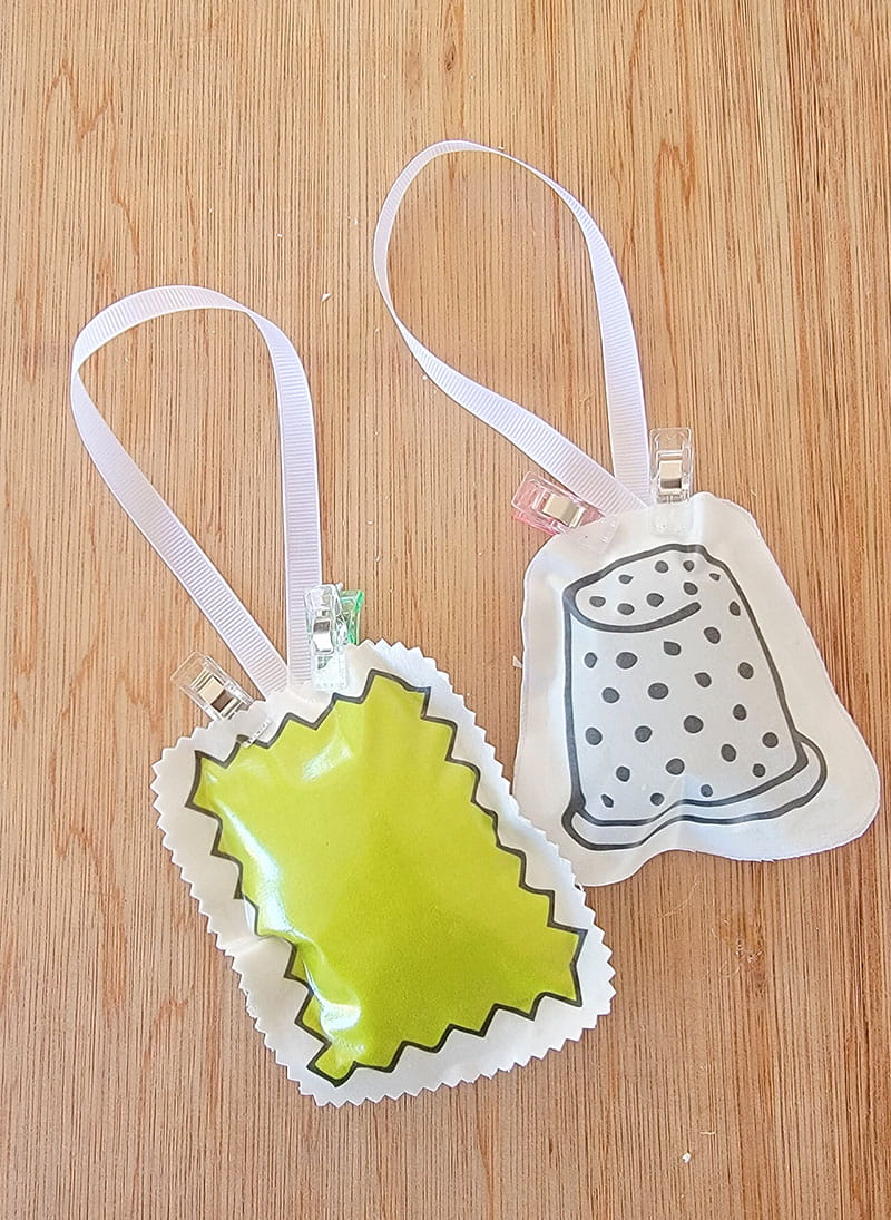 Plush ornaments with ribbons being held in place by fabric clips
