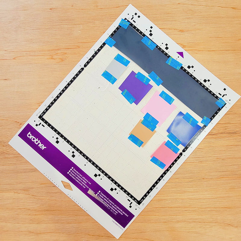Vinyl scraps taped to ScanNCut mat