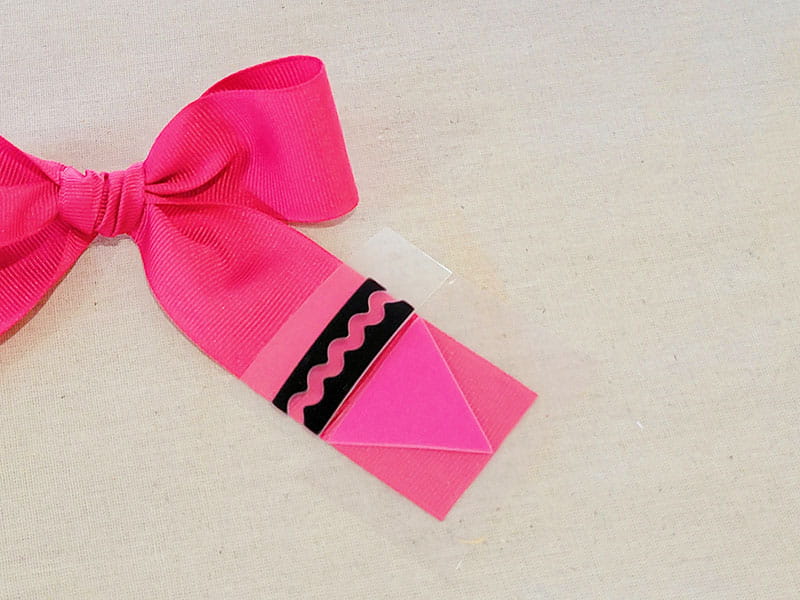 Close up of crayon detail on hair bow.
