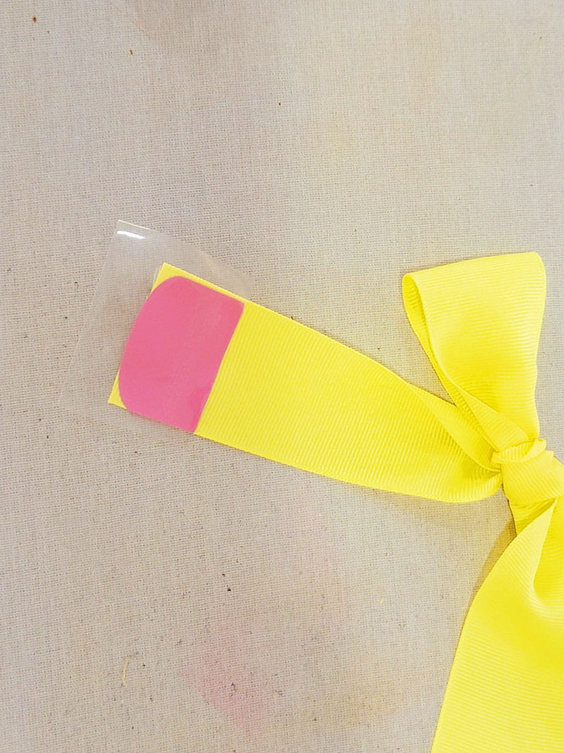 Pencil eraser detail added to left side of hair bow.