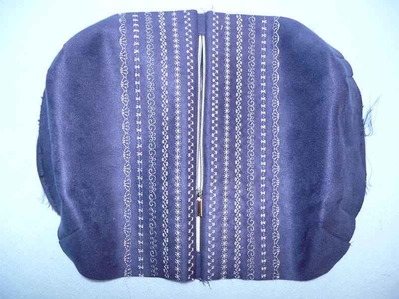 Top view of fabric being sewed for bag