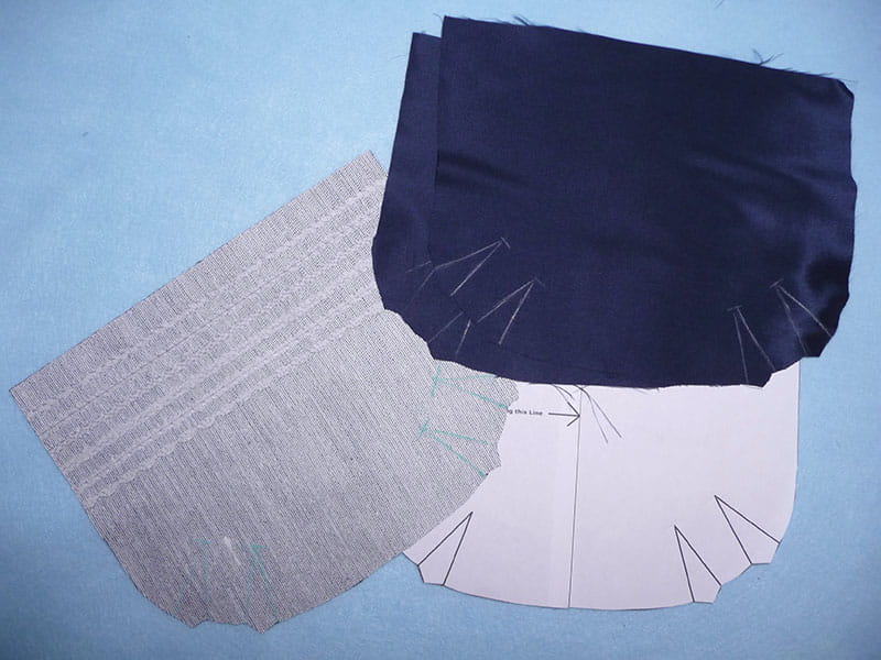 Three different colored fabrics being prepped for sewing