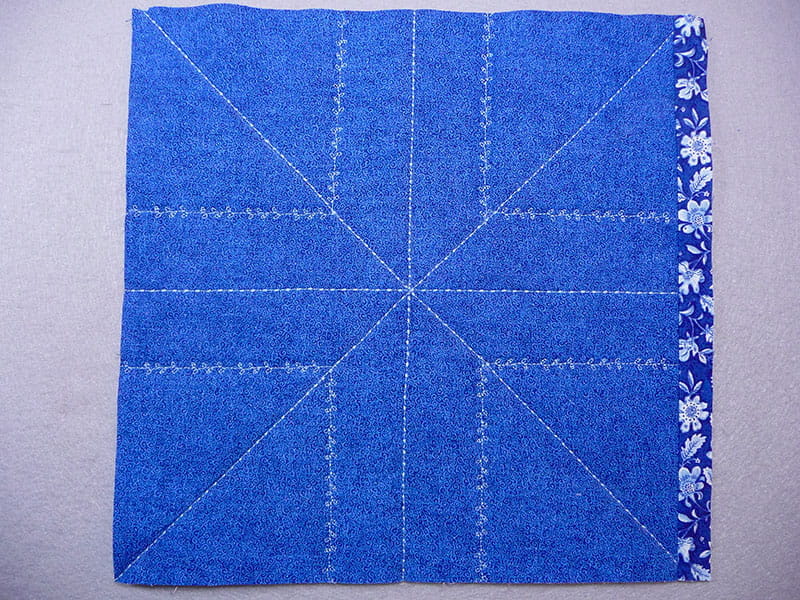 top view of the fabric with the corner piece sewed onto it