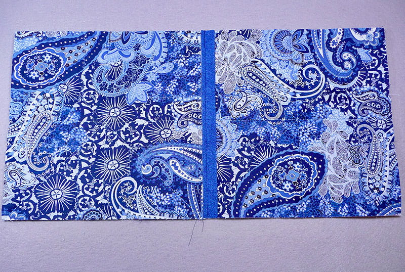 2 pieces of fabric sewed together on edges