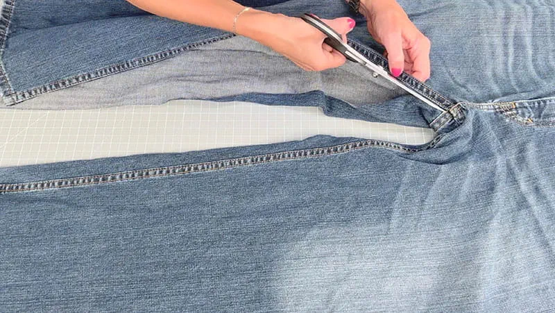 Cutting open a pair of jeans for DIY project