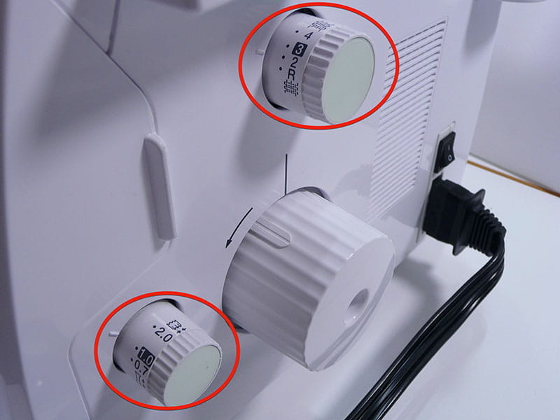Serger machine dials showing settings for serge stitch