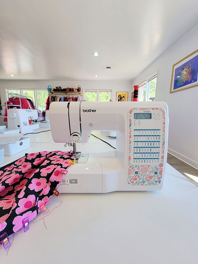 Stitching together the fabric using sewing machine