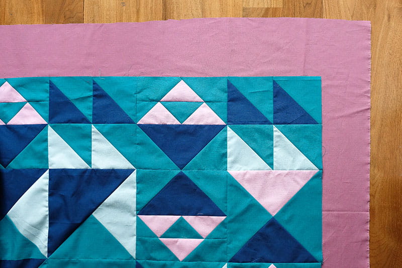 Quilt pattern on pink floor mat