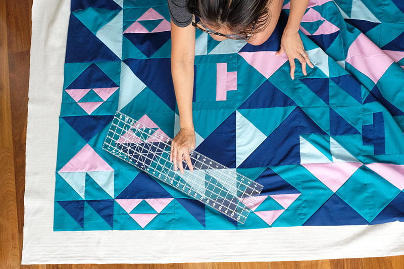 Using a ruler on the quilt pattern