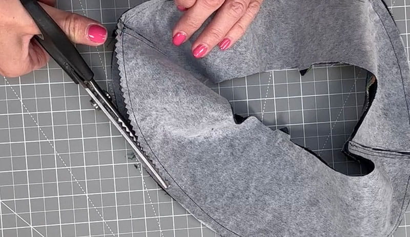 cutting close to the seam on the fabric 