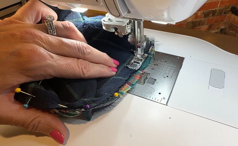 hand sewing bucket hat on the sewing machine