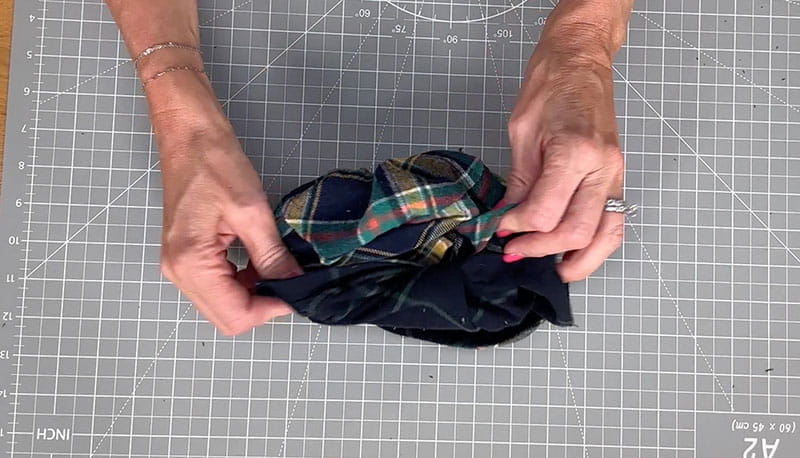 hands holding bucket hat turning right sides out