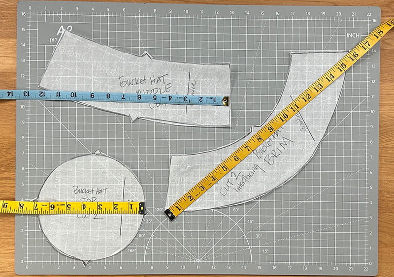 Pattern pieces on grid with tape measure