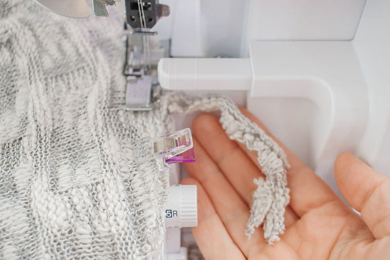 Showing how the knit should look like when going through the sewing machine