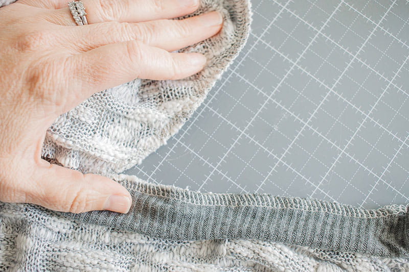 Ripping the fabric to get rid of the excess fabric