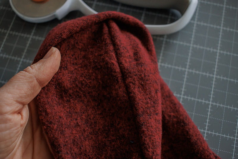Showing the thread sewed onto the sweater knit