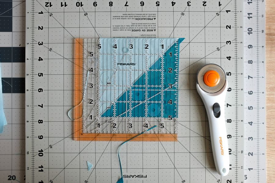 image of necessary tools rotary cutter, quilting ruler, cutting map
