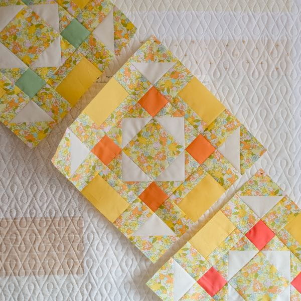 3 colorful quilted blocks of fabric