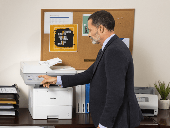 Man with suit using a brother printer