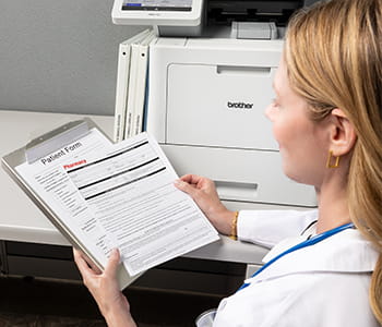 Nurse holding clipboard with stat sheet