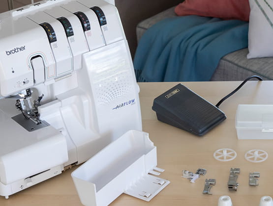 Closeup of accessory storage area, included accessories and presser foot