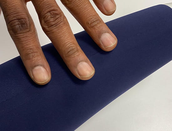 Hand running along the smooth seam created by a bonding machine