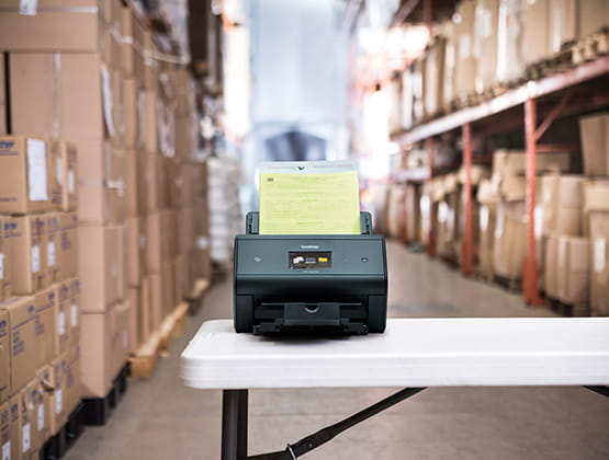 Brother ADS machine on table in warehouse