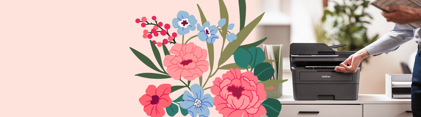 Brother printer on a file cabinet one a split pink background with blue and pink flower motif. 