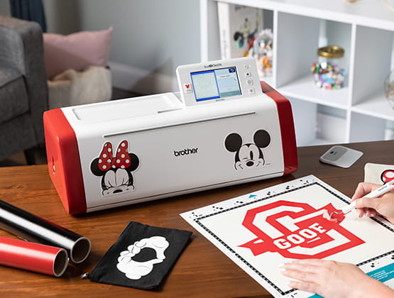 SDX230DI on table with craft supplies
