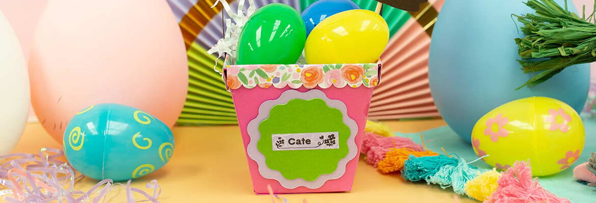 Completed P-touch Embellish Easter basket project filled with Easter eggs on table