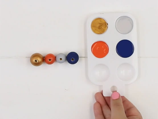 Paint pallet next to painted beads