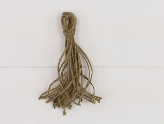 Rope tassel on white background