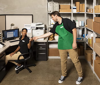 Retail workers in the back of the building