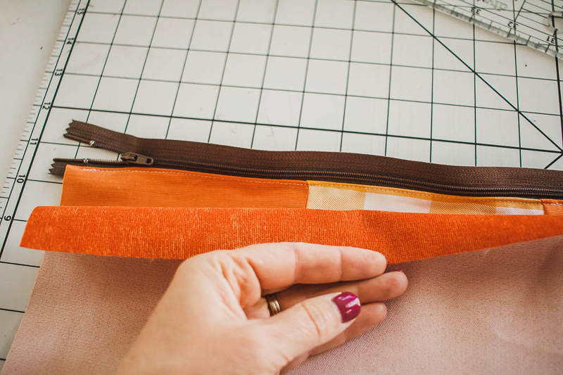 Sew zipper on backing