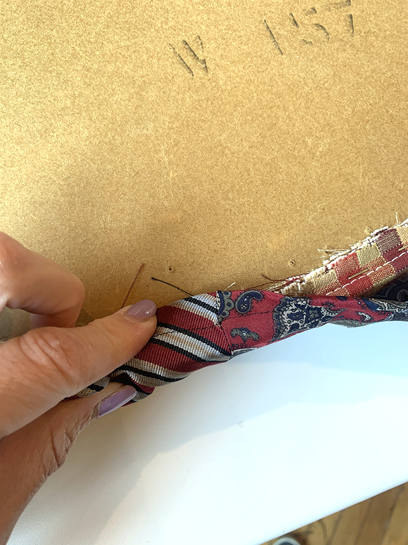 staple cover onto seat