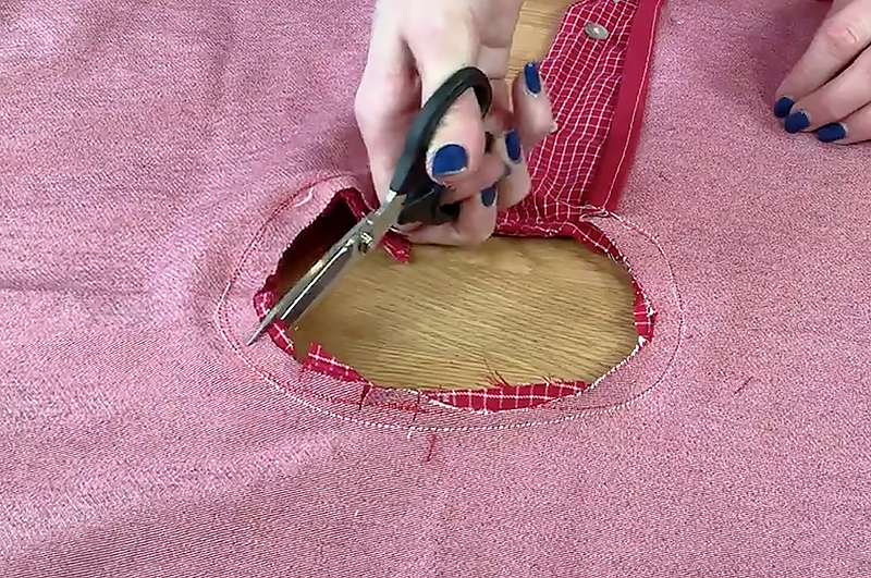 Trim edges and turn fabric over