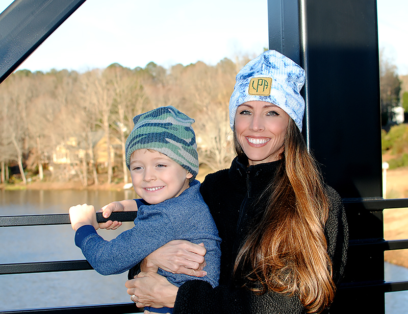 smiling and wearing beanies