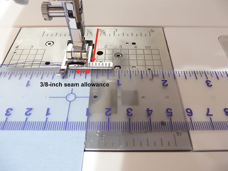 Line up the raw edge with the grooved line to sew with your stitch guide foot