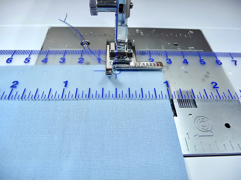 Line up the folded edge with the outside edt of the foot to stitch the hem