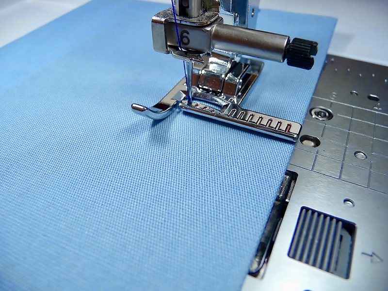 Begin stitching the hem with the stitch guide foot